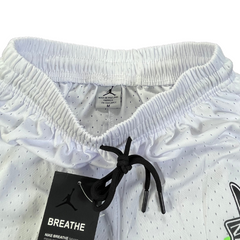 Nike Air Jordan White, Black, Green, and Red